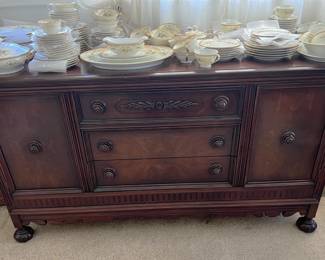 Under the dishes is this buffet table.
