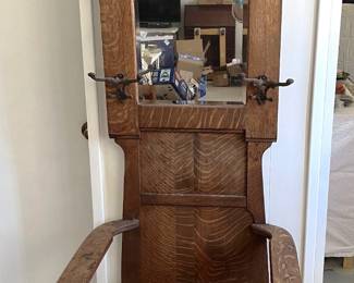 This chair is intended to sit near the entrance of your place and hold hats and coats, maybe an umbrella or two.
