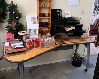 There's a lot to unpack here: the table, the small Christmas tree, drafting T-squares, and the angled table supporting it all.