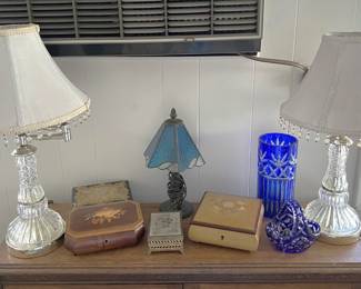 A pair of matching lamps, plus the blue glass vase and a couple more items can be seen here.