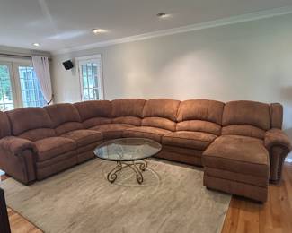 Comfortable sectional with sleeper sofa and recliner end chair.