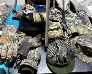 SO many like new and brand new Camo hunting items! You don't need to hunt, but this stuff is WARM for cold weather!