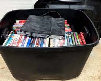 Tub Of Blurays And DVDs With Bluray Player