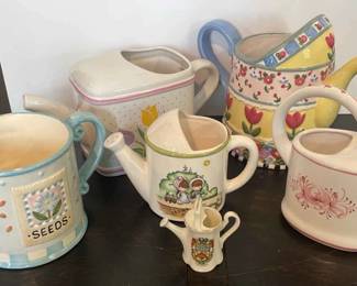 Six Ceramic Watering Cans