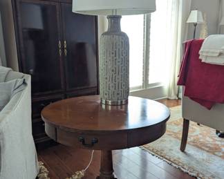 round Mersman drum table with drawer, single large lamp