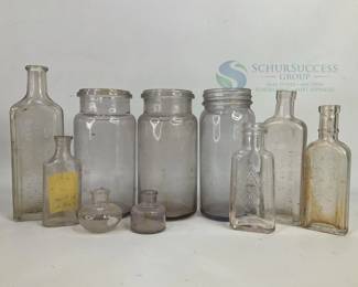 Vintage Higgins & Co. Glass Bottles with Embossed Markings