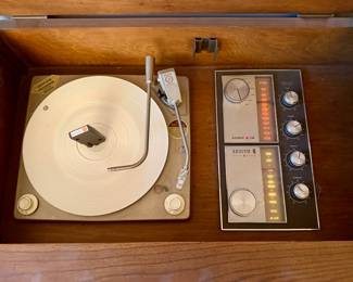 What we have is a Genuine Zenith Mono/Stereo Cabinet thet is in a Working Condition.  Radio Sounds Great on WXRT and  Phono does rotate,