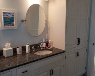 Double bath vanity incudes storage tower