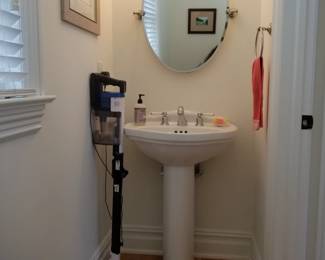 Pedestal sink; vanity mirror & light