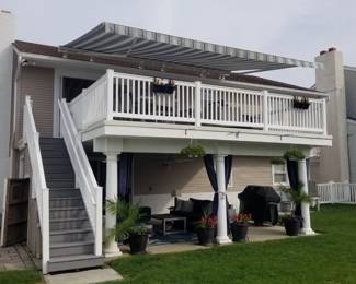 Electric awning with remote control; limited amount of vinyl railing