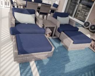 All weather wicker chairs & ottomans; outdoor rug