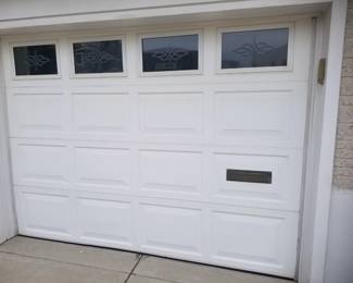 Garage door with mail slot