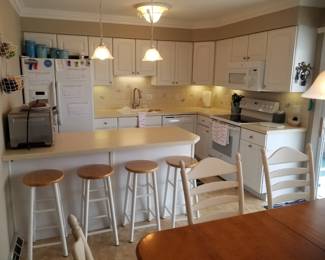 L-shaped kitchen with peninsula; pendant lights' ceiling light fixture