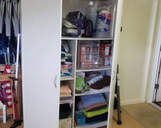 Large storage cupboard - interior view. Beach and household supplies