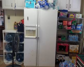 Garage fridge; floor fan; bottled water for water cooler; shelving, cabinets and household supplies