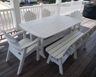 Polyresin patio dining set includes table; 4 chairs & one bench