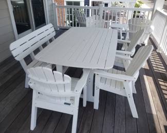 Polyresin patio dining set includes table; 4 chairs & one bench