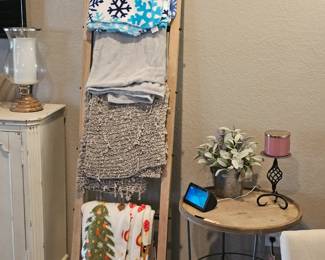 blanket ladder with blankets and quilts