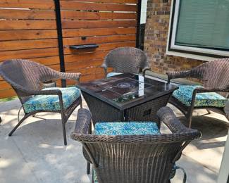 Outdoor seating, 4 chairs, table with fire pit inside