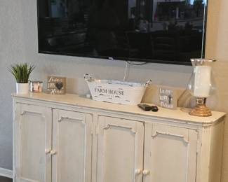 white console with lots of storage, flatscreen also available