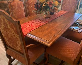 Wood and wrought iron dining table with chairs