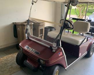Early 2000s club car with charger. In great working condition!