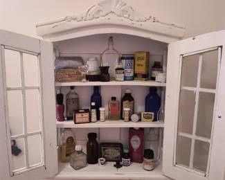 Antique medicine cabinet and contents 