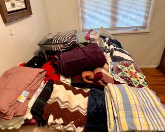 Many nice blankets, comforters and bedding