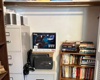 Fire proof two drawer cabinet, several UPS backup units, four drawer file cabinet, other new electronics
