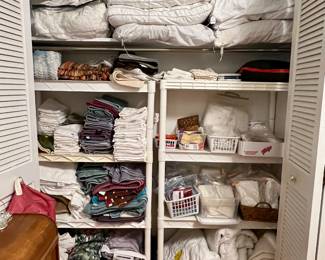 Large amount of linens and bedding.