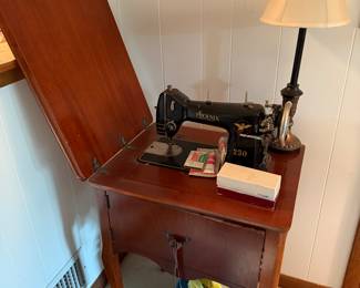 Vintage singer sewing machine in cabinet