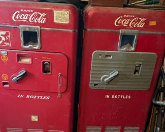 2 vintage Coca Cola machines