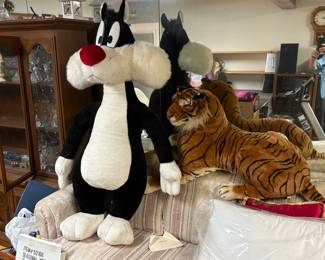 large stuffed animals on sleeper sofa