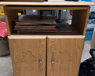 Nice Television Entertainment Center with swivel top to angle TV. Cabinets underneath for devices and stuff.