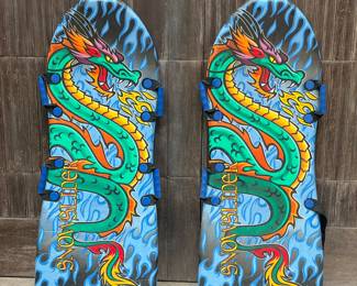 (2pc) Pair Snowboards | Pair of Snowsliders with Dragons and four handles. One handle is broken.
Dimensions: w. 21 x l. 52 in