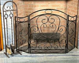 (4pc) Fireplace Tools & Screen | Black wrought iron foldable screen with scrolled vine pattern. Wrought iron brown metal stand with 3 hooks, including a shovel and broom with twisted rods. Poker is missing.
Dimensions: h. 31.5 x w. 50 in (Screen, 37” h stand)