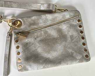Hammitt Suede & Leather Handbag / Shoulder Bag | Nash embossed clutch by Hammitt. Havingan external cell phone pocket, wristlet strap, zippered compartment, adjustable cross-body strap and embossed rivets. Made of leather with red cotton lining - h. 8.25 x w. 11.25 in