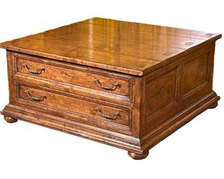 Low Polished Wood Coffee Table By The Sterling Collection | Square-shaped low table, featuring two drawers that glide easily on each end. Constructed of knotty wood with interesting dark grain.
Dimensions: h. 18 x w. 36 x d. 36 in