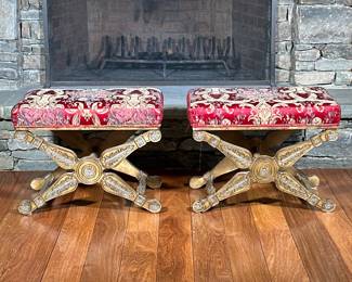 Pair Casa Stradivari X-Form Carved Wood Benches | Or stools, with textured red upholstered cushioned seats and X-form base with foliate carvings in giltwood and turned stretchers. - h. 18.5 x l. 24.25 x d. 16.5 in