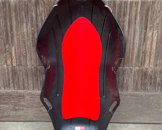 Black Plastic & Styrofoam Sled | Black plastic sled with handles and rope for pulling. Red styrofoam lining. - h. 6.5 x w. 26 x l. 47 in