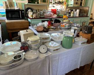 The kitchen is crammed with vintage and collectible items lining the walls and countertops!