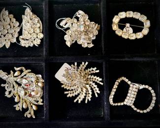 Rhinestone brooches, some are Eisenberg