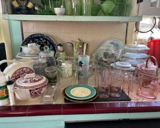 Too much to believe: lots of glassware, and look, there is a large Chinese Famille Noir charger in the back!