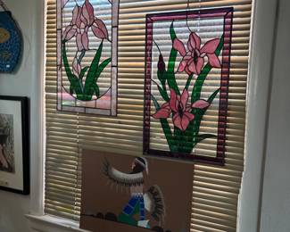 The jewelry rooms walls are lined with art works including stained glass, paintings, and prints