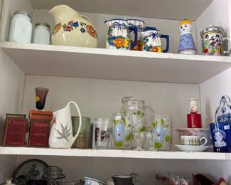 Vintage kitchen items: pitchers and advertising spices, etc.