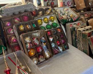 Tables of vintage old world ornaments in their original boxes