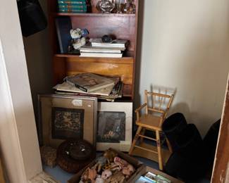 Notice the three pots on the top of the book shelf two of these pots are by Contemporary Native American potters and one is a vintage Amazonian Shipopo pot, there is also a Mustang hood ornament, books, and ephemera