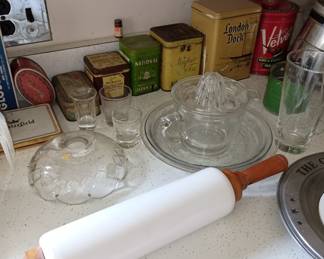 Collectible tins and milk glass rolling pin