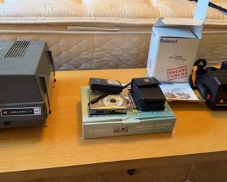 A Canon Powershot SD750, A Polaroid, And An Anscomatic Projector