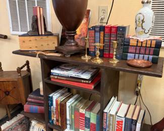 Vintage books are scattered all over the store space along with decorating beauties.
